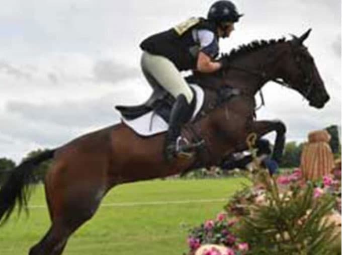 Ruth jumping a fence on Libby